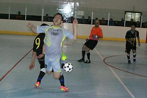 Antonio Padilla, of Scorpion, taking flight above, was the men’s open futsal final’s most valuable player.