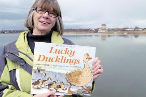 Eva Moore, standing at Fort Pond in Montauk, knew immediately that the story of the rescue of several ducklings would make a good picture book.