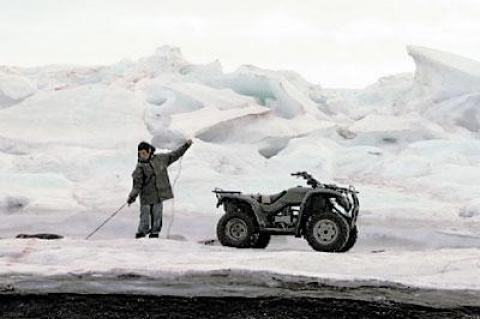 A Kivalina islander dropped a seal carcass into the water after a June 2011 hunt, one of many traditions Gina Abatemarco experienced on visits to the tiny Alaskan island during the making of her documentary “Kivalina People.”