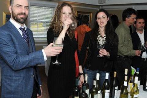 Gioveanni Caveggia assisted Jennifer Etzkin, center, and Sarah Diehl of the East Hampton Grill in their wine exploration at the Vias Imports First Annual Spring Tasting, held at the Palm restaurant on April 23.