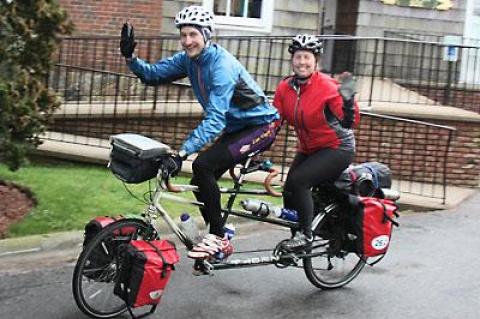 An English couple touring aboard a tandem bike that folds in half stopped by the L.V.I.S. in East Hampton on April 23, intrigued by the sign.