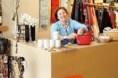 Theresa Davis, the manager of LongHouse Reserve’s new Instore museum shop, is surrounded by one-of-a-kind objects from the world’s most exotic places.