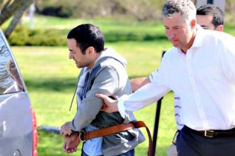 Harry Dalian, left, at his arraignment Friday on charges that he impersonated a police officer during a visit to the John M. Marshall Elementary School in East Hampton on May 1.