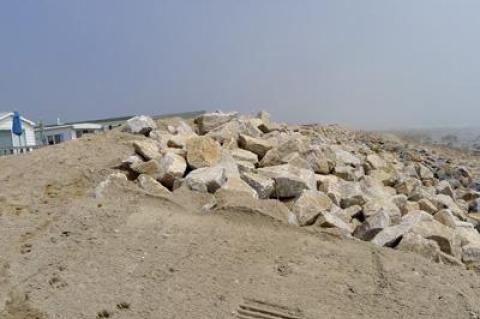 A newly expanded stone revetment that stands between the Montauk Shores Condominium and the Atlantic Ocean is under investigation to determine whether it was installed according to permit specifications.