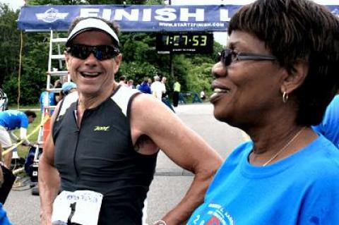 Eben Jones, once the world’s top amateur triathlete, and a nine-time winner at Montauk, was among those celebrating the race’s 30th anniversary last year. At the right is the race director Merle McDonald-Aaron.