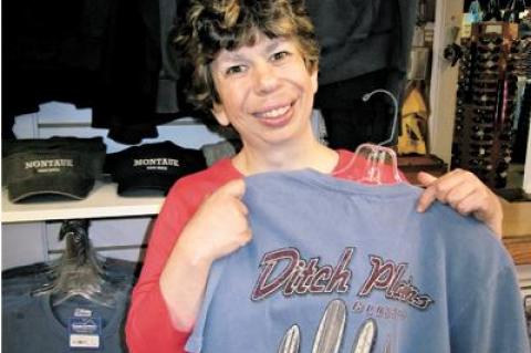 Jessica Mavro, an employee at Montauk Clothing Co., showed off one of its many “Ditch Plains” T-shirts.