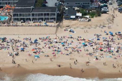 An extra-long holiday weekend and sunny skies brought happy crowds to the beaches at South Edison in Montauk, above, and all over the South Fork.