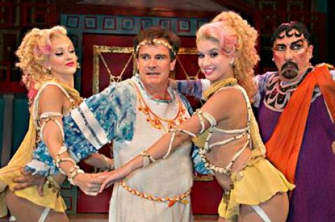 Peter Scolari, at left, barely manages to reject the charms of the Geminae Twins, Shiloh Goodin and Phoebe Pearl, as the buyer and seller of courtesans, Laurent Giroux, looks on.