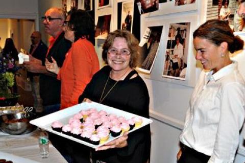 Mary Croghan, center, the owner of East Hampton Business Service, passed out cupcakes during a throw-down at Ashawagh Hall in Springs on Monday to celebrate her business’s 35th anniversary.