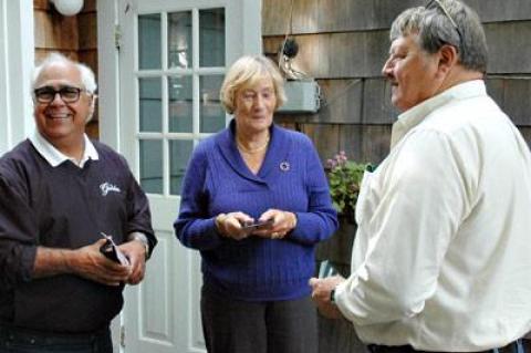 Councilman Dominick Stanzione, left, and Town Clerk Fred Overton chatted with Wibke Sullivan of Church Street, East Hampton, on Oct. 9.