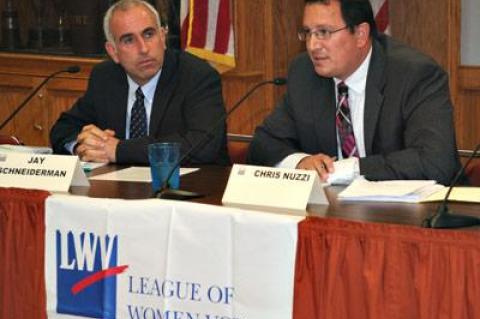 County Legislator Jay Schneiderman and Southampton Town Councilman Chris Nuzzi at a debate in East Hampton. Mr. Nuzzi hopes to unseat Mr. Schneiderman on Nov. 5.