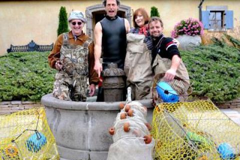 John Landes, Joshua Perl, Molly McKenna, and J. Kelly Caldwell got wet on Sunday in the Wolffer Estate Vineyard’s fountain to highlight the theme of the “Water’s Edge Radio Hour.”