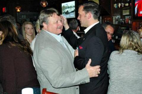 Town Clerk Fred Overton, left, who won a sole Republican seat on the town board, was congratulated by Carl Irace, who lost his bid for town justice, at Indian Wells Tavern on Tuesday.