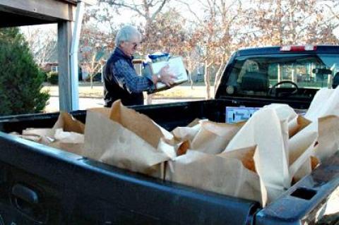 John Ryan, a volunteer with the East Hampton Food Pantry, loaded his truck with bags of food to be transferred to the pantry’s satellite location in Amagansett. With winter approaching, pantry officials said they are operating on dangerously thin supplies.