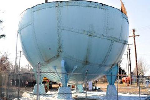 National Grid workers are disassembling a decommissioned gas ball on Railroad Avenue in East Hampton Village.