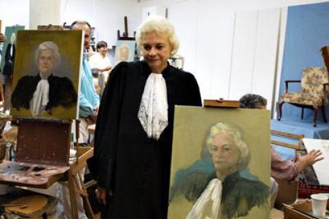 Former Supreme Court Justice Sandra Day O’Connor posed with some of the 25 paintings from Neil Leifer’s film “Portraits of a Lady.