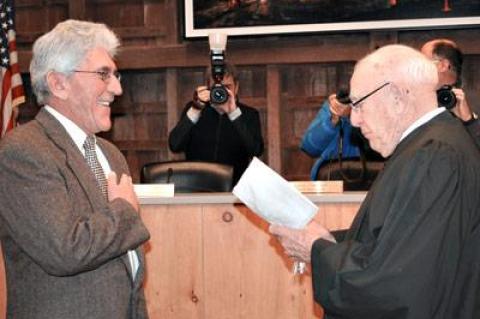 Larry Cantwell, East Hampton Town’s new supervisor, was all smiles while being sworn into office last Thursday by former Town Justice James R. Ketcham.