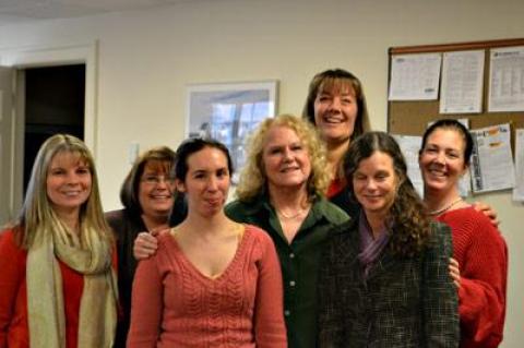 Emily Grunewald, center, with her fellow court clerks just days before her retirement last month, after 23 years on the job. From the left were Nicole Shipman, Michelle Field, Tamara Palmer, Ms. Gruenwald, Jennifer Anderson, Betsy Martin, and Jennifer Salsedo.