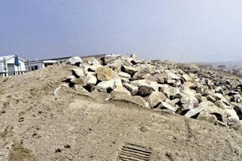 Settlement negotiations are underway between the Department of Environmental Conservation and Montauk Shores Condominiums over a rock revetment the state said was improperly installed last year.