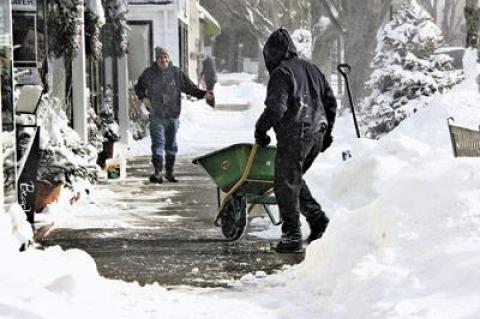 People dug out from a January snowstorm, the first of many they would face down this year.