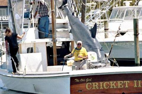 The late Frank Mundus hammed it up with a replica of a white shark catch aboard the Cricket II in 2005.