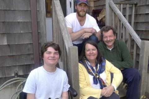 The Lightcap family, Terence Lightcap (in chair) Grace, Ed, and Dustin (on stairs) will hold a yard sale on Memorial Day weekend to raise money for research into drugs that could help Terence, who has Duchenne muscular dystrophy.