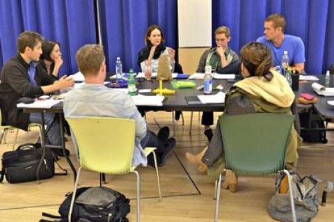 Scott Schwartz, the director, and Carey Crim, the author of “Conviction,” at left, exchanged ideas with the cast during an early rehearsal in New York. Bill Hutchison and Elizabeth Reasor had their backs to the camera, while opposite them were Sarah Paulson, Daniel Burns, and Garret Dillahunt.