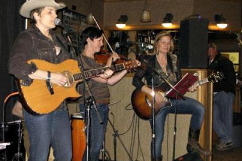 Inda Eaton, left, and Nancy Atlas, on guitar, were joined at their Casper shows by Jen DePaolo of the Wyoming Symphony Orchestra.