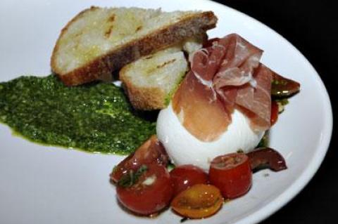 Fresh mozzarella, prosciutto, tomatoes, and pesto