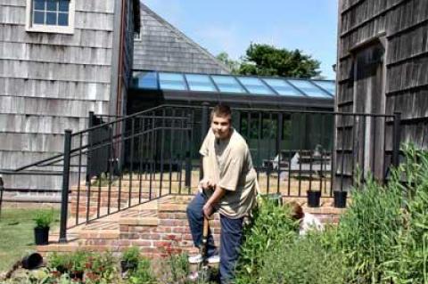 Matt Lester, a Life Scout working toward becoming an Eagle Scout, helped members of the Garden Club of East Hampton install a butterfly garden at East Hampton Town Hall Monday.