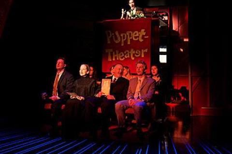 Aloysius Gigl, Isabel Keating, Andrew Weems, Michael Benz, Emily Trask, Julia Motyka, Carson Elrod, from left, in “Travesties,” a Tom Stoppard play about artists and revolutionaries performed for the tanned and the shellacked.