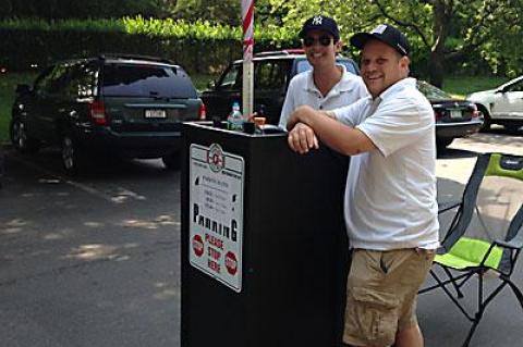 Joe Donohue, left, an attendant, and Mike Goldsmith, a supervisor, manned the new parking hurdle in Amagansett Square last week.