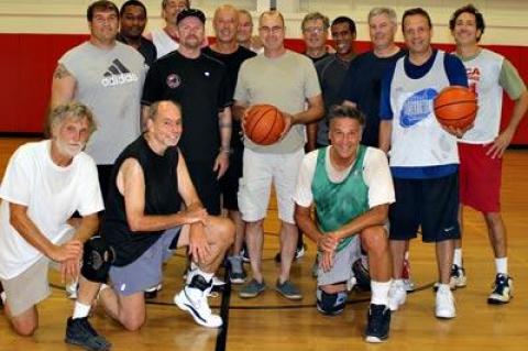 Richard Hand, center, stopped by the Pierson middle school gym on Sunday to thank fellow basketball players who had resuscitated him when he was in cardiac arrest just a week earlier.