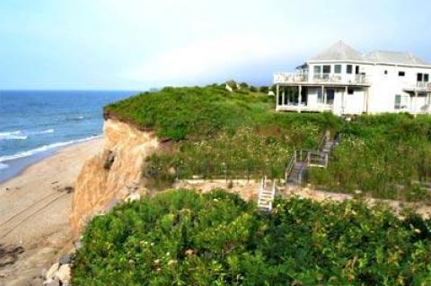 John Ryan is facing heavy opposition to his proposal to install an oceanfront stone revetment to protect his house on Surfside Avenue in Montauk.