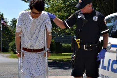 Jungsik Lee used crutches Tuesday to walk into East Hampton Town Justice Court, where he was arraigned on drunken-driving charges in connection with an accident.