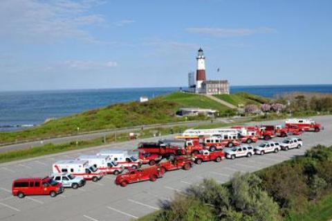 The Montauk Fire Department recently assembled its trucks and ambulances for a photograph at the Lighthouse. It will be joined by a number of other departments for a 75th anniversary parade on Saturday.