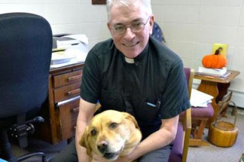 The Rev. Thomas Patrick Murray of St. Therese of Lisieux Catholic Church, with his dog, the Monsignor, compares Montauk to Mayberry.