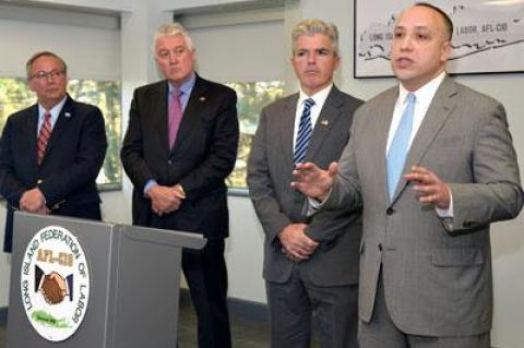 Jeffrey Grybowski, at right, pledged to create jobs on Long Island to support the construction of the Deepwater One offshore wind farm. With him were, from left, John Durso of the Long Island Federation of Labor, Dick O’Kane of the Nassau-Suffolk Construction and Building Trades Council, and Suffolk County Executive Steve Bellone.