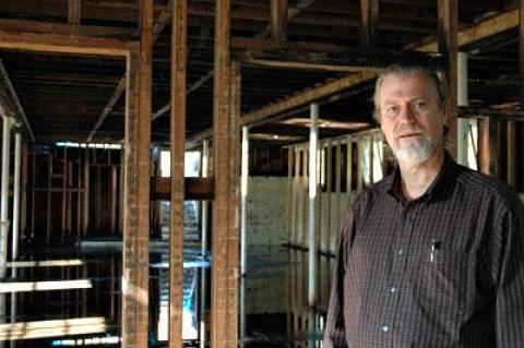 The Rev. Steven Howarth stood in the burned-out basement of Scoville Hall last month. The building, destroyed by fire in 2011, was demolished on Tuesday.