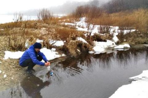 Jay Levine, a member of the board of Concerned Citizens of Montauk, took a water sample earlier this year in a creek that drains into Lake Montauk.