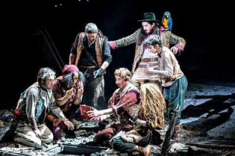 Long John Silver, with parrot, and his fellow pirates discover something astonishing in the National Theatre’s new production of “Treasure Island,” which will be simulcast at Guild Hall on Saturday.