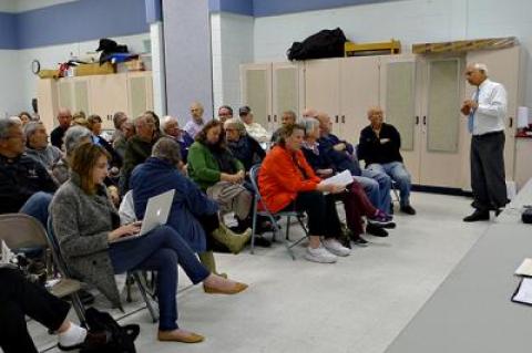 Pio Lombardo, standing at right, a consulting engineer, discussed a proposal to create a centralized wastewater treatment system for downtown Montauk properties at a meeting of the Montauk Citizens Advisory Committee on Monday night.