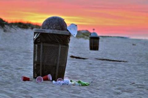 Critics of beach garbage cans, including the East Hampton Town Trustees, say that cans like these on Main Beach create more problems than they solve.