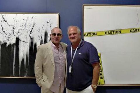 Bernie Taupin, left, and Mark Borghi shared a moment together in the Borghi booth at Art Southampton during last Thursday night’s “platinum V.I.P. preview.”