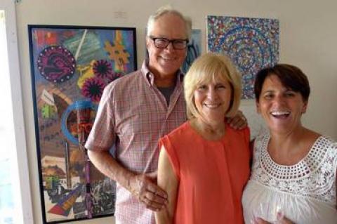 Tom Griffin, a board member, and his wife, Helene Griffin, with Lisa DeVeglio, the president of the Montauk Playhouse Community Center Foundation, at the opening reception Saturday for a pop-up art gallery to benefit the Playhouse.