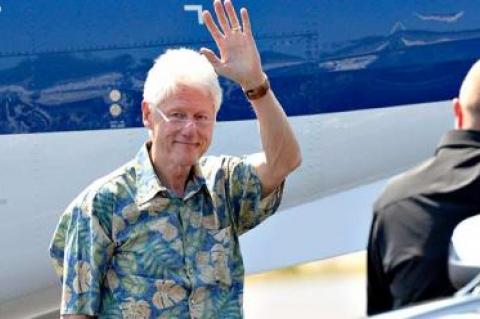 Bill Clinton arrived at East Hampton Airport on Sunday. Hillary Rodham Clinton was expected in town on tomorrow.