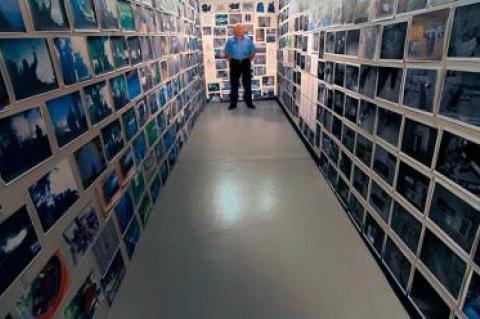 William (Dub) Lawrence filled a corner of his airplane hangar with evidentiary photographs as part of his personal investigation into the death of his son-in-law.