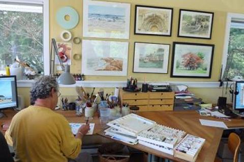 Peter Gumpel, who works exclusively with watercolors, was surrounded by the tools of his trade in his Springs studio.