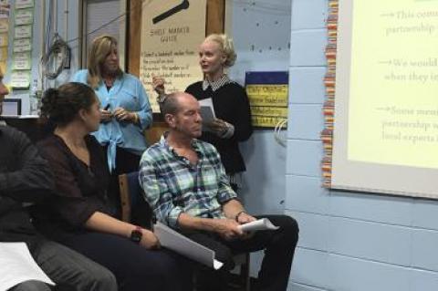 Jodie Hallman, standing at left, and Susan Harder, at right, presented the recommendations of the Springs School facilities committee on Monday night, which included adding modular classrooms to solve the district’s immediate space needs.