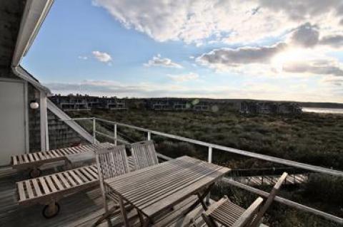 Sunsets and cloudscapes over Montauk’s Fort Pond Bay dominate the outdoor deck.